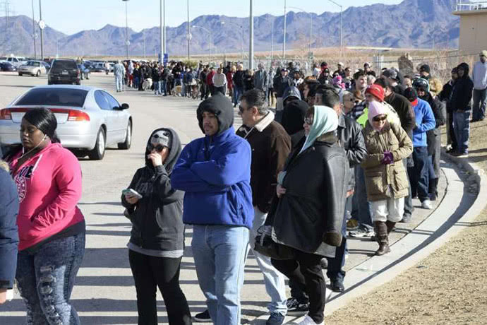 People stand in line to buy Powerball tickets